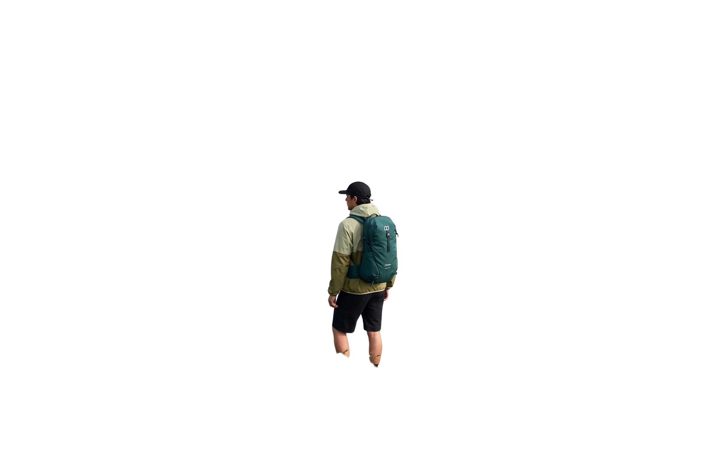 A walker above a coastal cliff with a green daypack