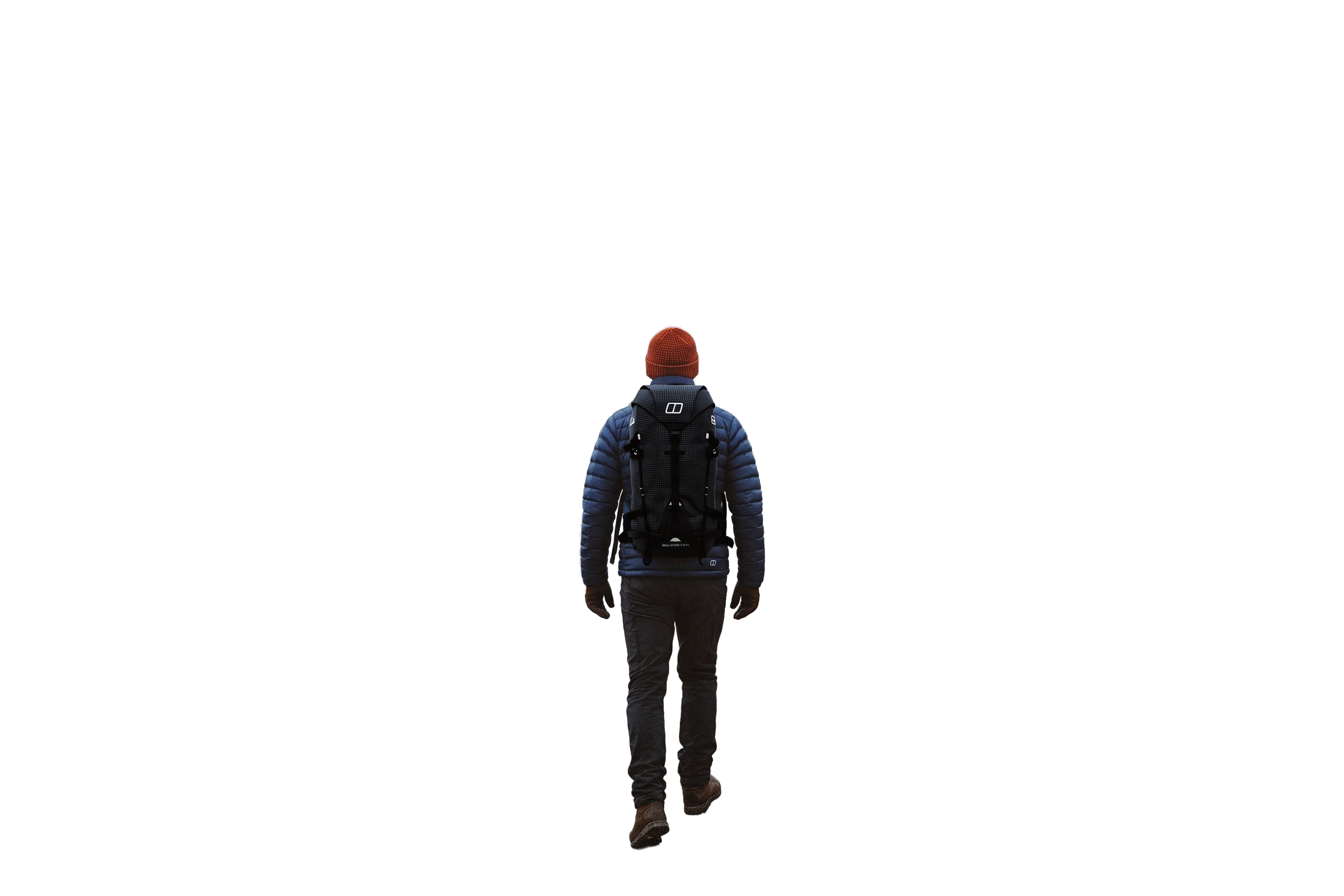 A walker heading towards a snow-covered ridge
