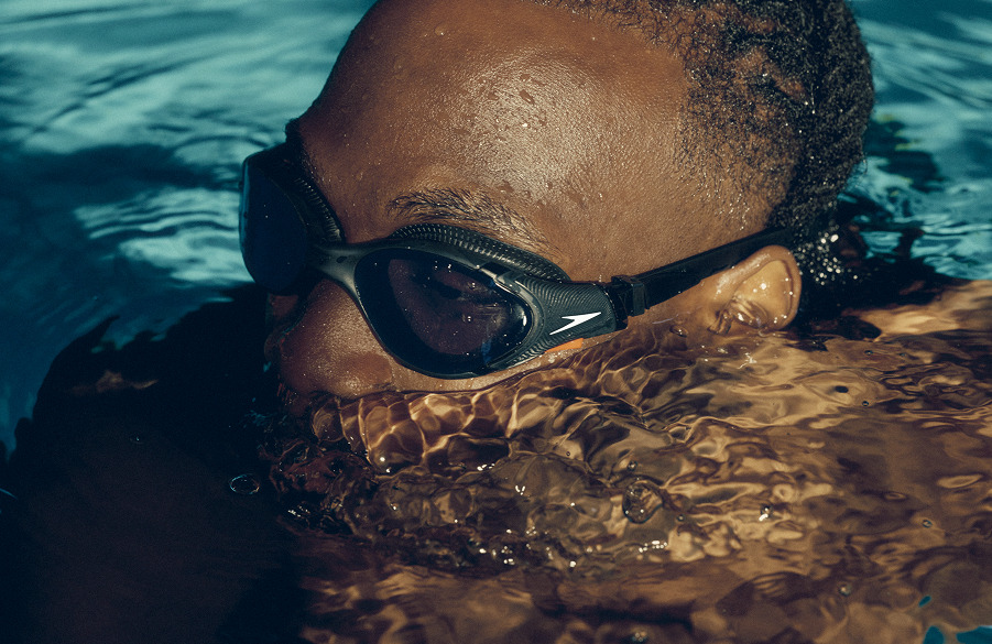 Close up of a swimmer in goggles at the waterline